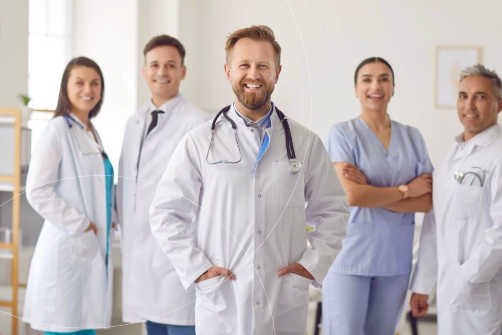 Medical team smiling in a hospital setting.