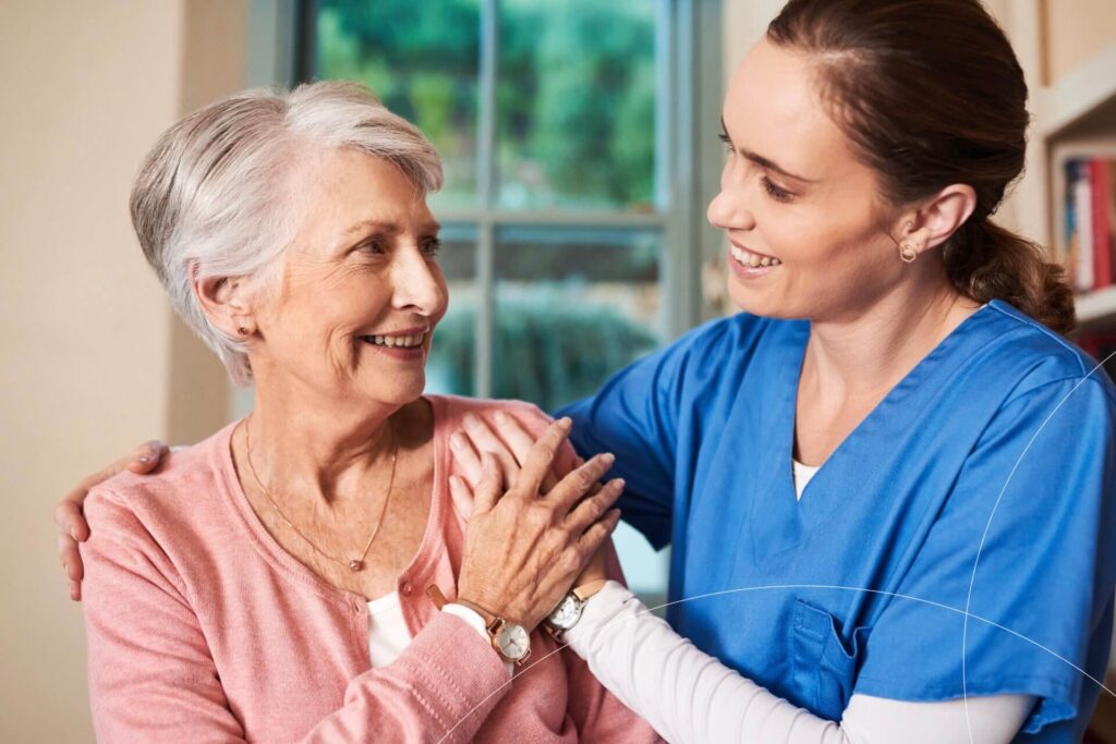 Study nurse comforting an elderly female patient