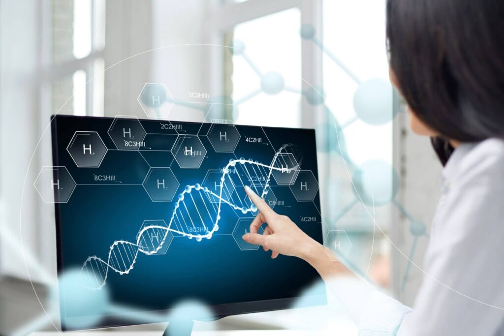 A researcher analyzes a DNA structure on a screen, representing SCIRENT's adept handling of global and regional regulatory aspects in gene therapy.